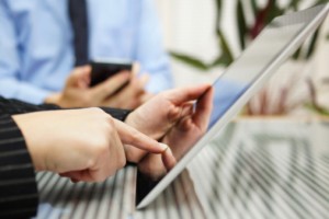 Businesspeople working with smartphone and tablet